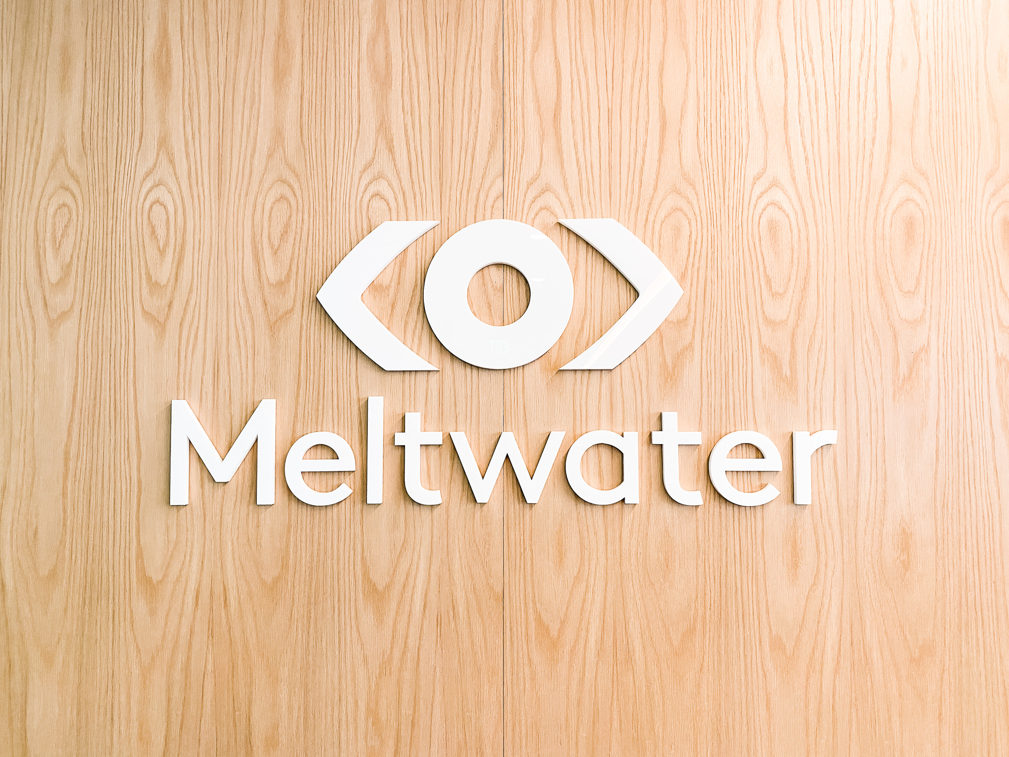 White logo on light wood add-on divider wall for the San Francisco office of Meltwater, a software as a service company that develops and markets media monitoring and business intelligence software. White logo on light wood add-on divider wall for the San Francisco office of Meltwater, a software as a service company that develops and markets media monitoring and business intelligence software.