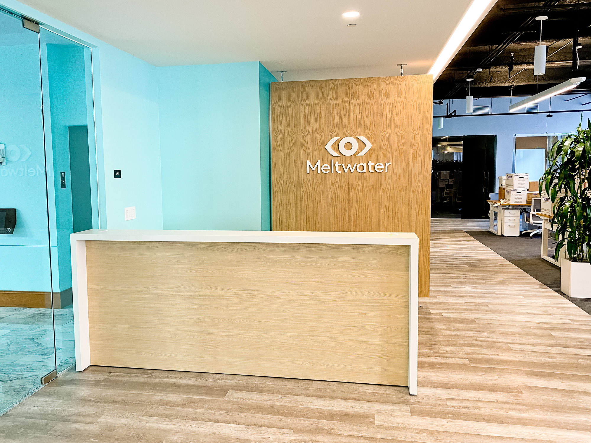 White logo on light wood add-on divider wall for the San Francisco office of Meltwater, a software as a service company that develops and markets media monitoring and business intelligence software. White logo on light wood add-on divider wall for the San Francisco office of Meltwater, a software as a service company that develops and markets media monitoring and business intelligence software.