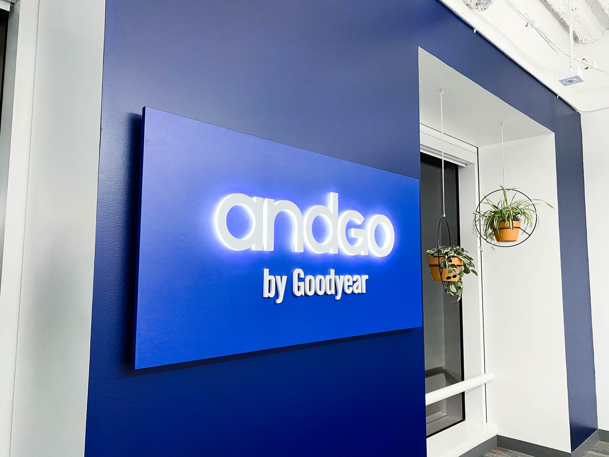 Illuminated, blue, edge-lit sign for the San Francisco office of andgo by Goodyear, a seamless vehicle-servicing platform designed to help consumer fleets monitor their service needs and improve their scheduling. Illuminated, blue, edge-lit sign for the San Francisco office of andgo by Goodyear, a seamless vehicle-servicing platform designed to help consumer fleets monitor their service needs and improve their scheduling.