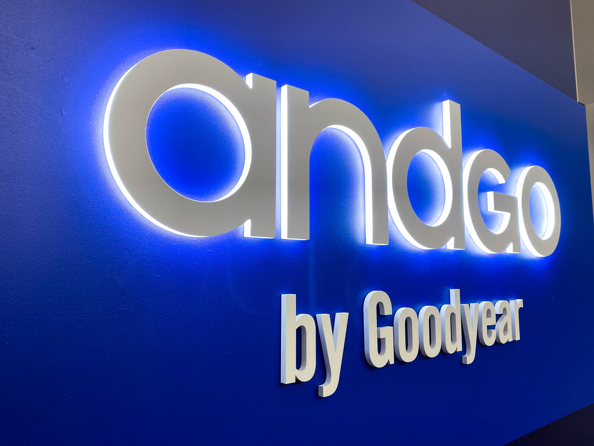 Illuminated, blue, edge-lit sign for the San Francisco office of andgo by Goodyear, a seamless vehicle-servicing platform designed to help consumer fleets monitor their service needs and improve their scheduling. Illuminated, blue, edge-lit sign for the San Francisco office of andgo by Goodyear, a seamless vehicle-servicing platform designed to help consumer fleets monitor their service needs and improve their scheduling.