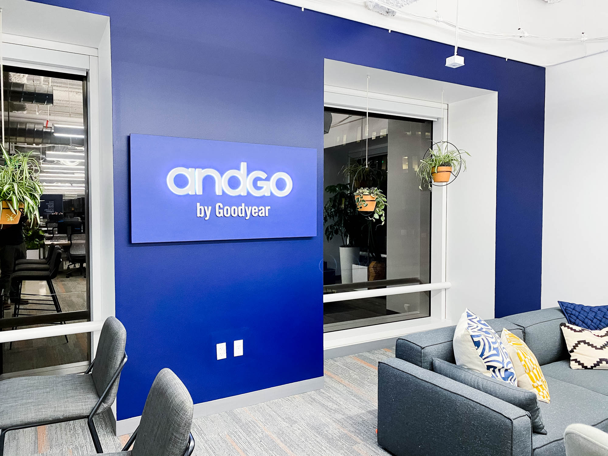 Illuminated, blue, edge-lit sign for the San Francisco office of andgo by Goodyear, a seamless vehicle-servicing platform designed to help consumer fleets monitor their service needs and improve their scheduling.