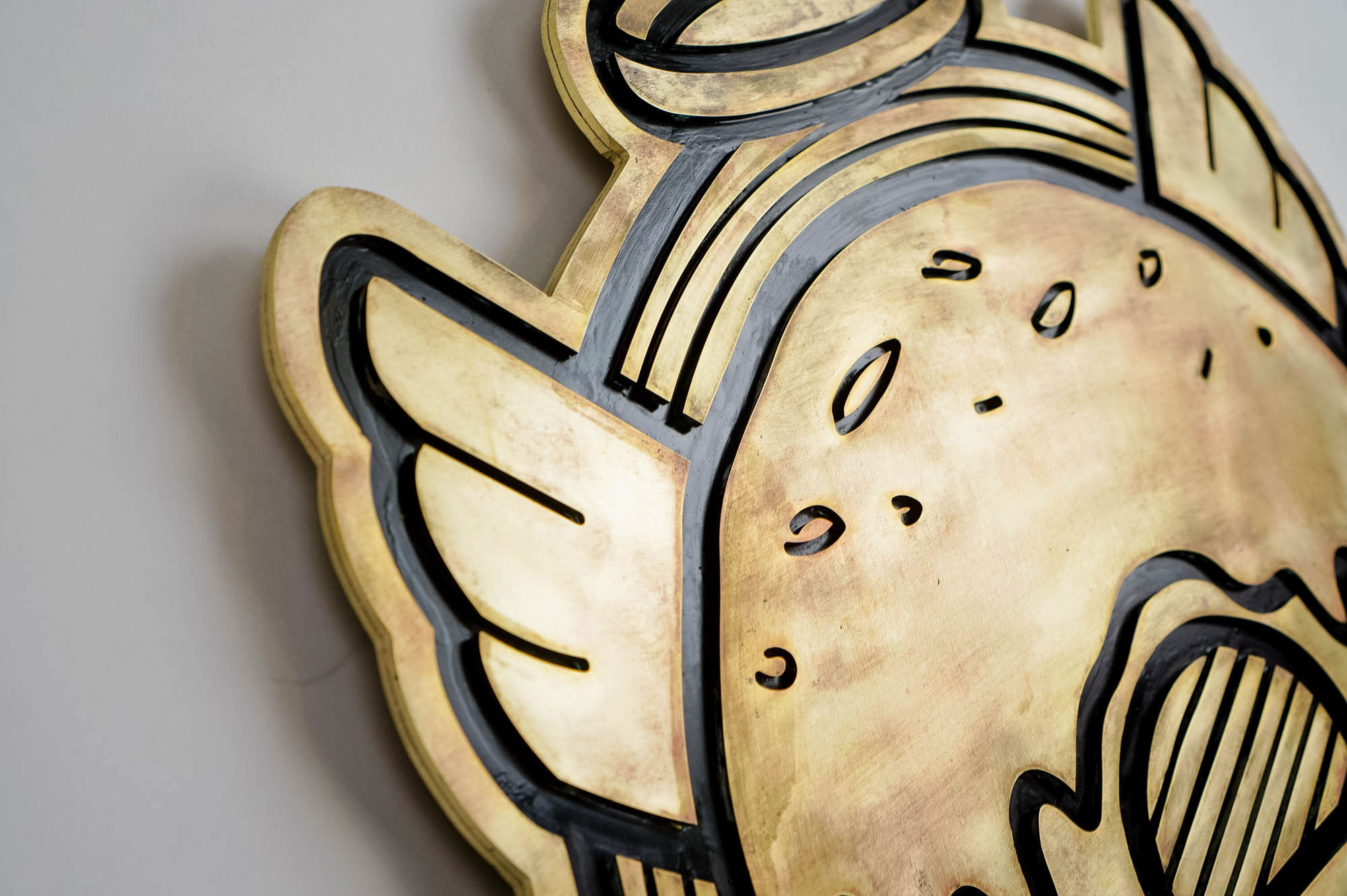 Patinated, retro brass sign for Holey Grail, a donut shop based in Hawaii. Patinated, retro brass sign for Holey Grail, a donut shop based in Hawaii.