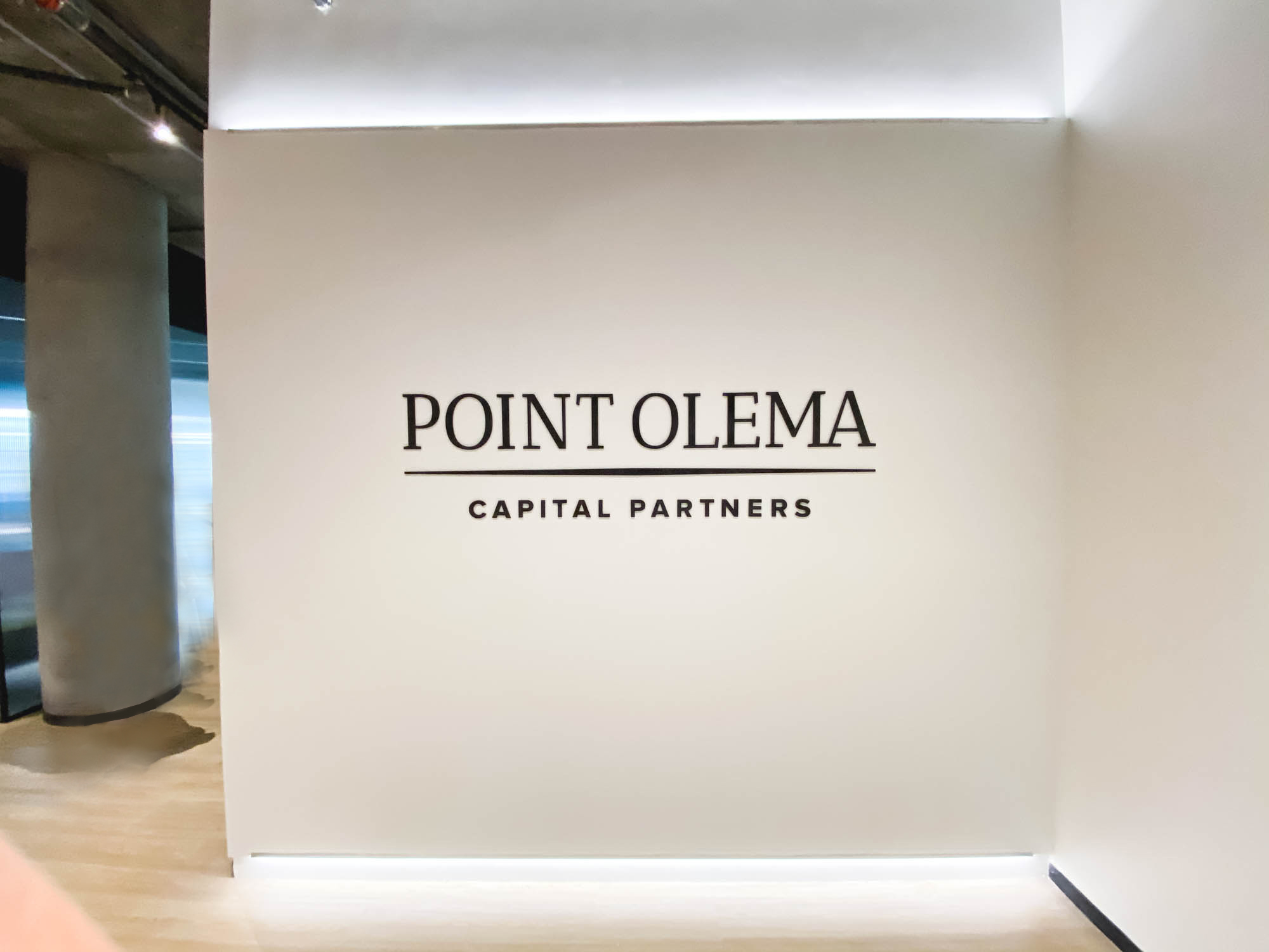 Simple black lobby sign on painted wall with uplights for the San Francisco office of Point Olema Capital Partners. Simple black lobby sign on painted wall with uplights for the San Francisco office of Point Olema Capital Partners.