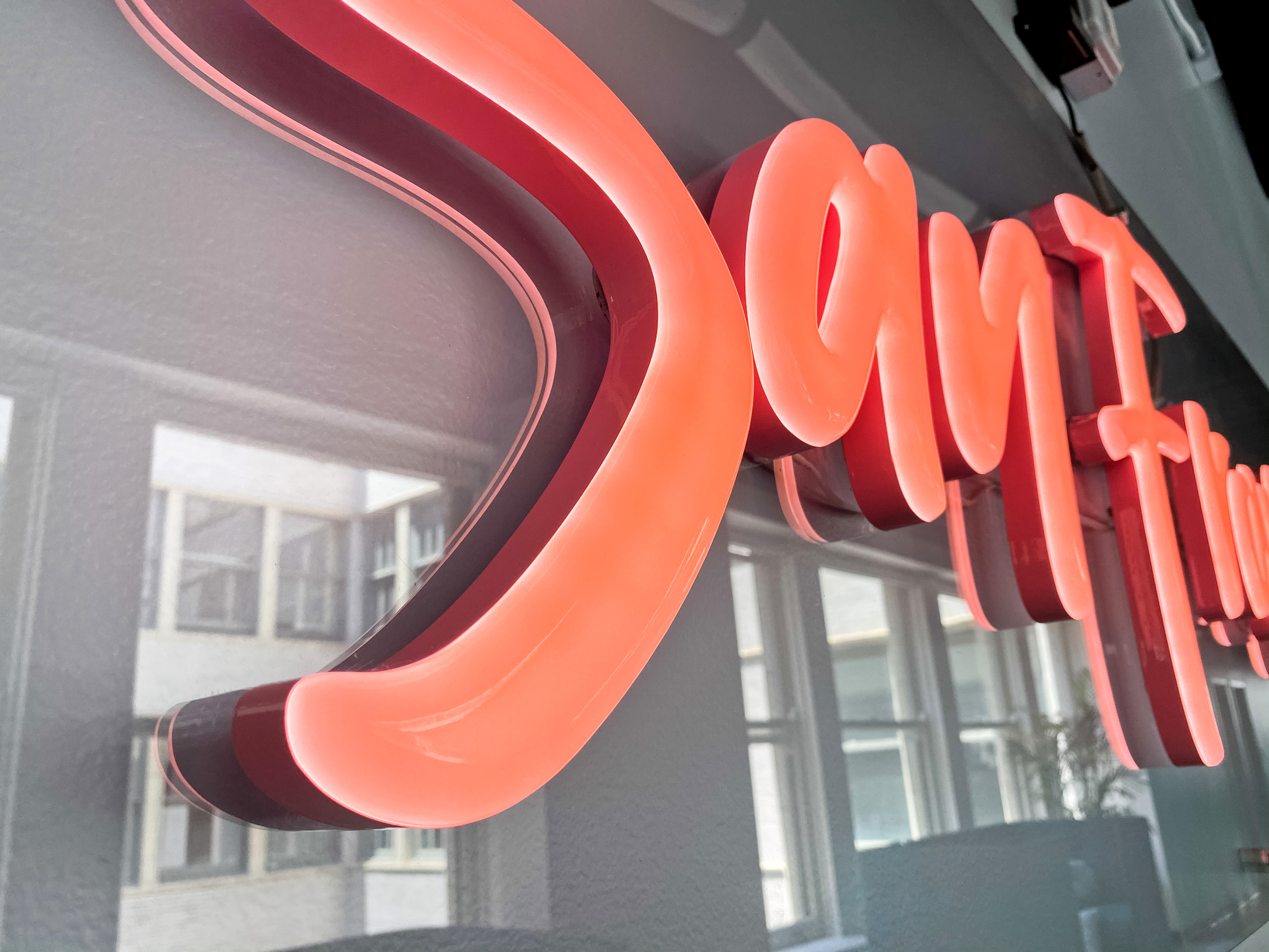 Pink script LED neon sign on clear backer for the San Francisco office of Meltwater, a software as a service company that develops and markets media monitoring and business intelligence software. Pink script LED neon sign on clear backer for the San Francisco office of Meltwater, a software as a service company that develops and markets media monitoring and business intelligence software.