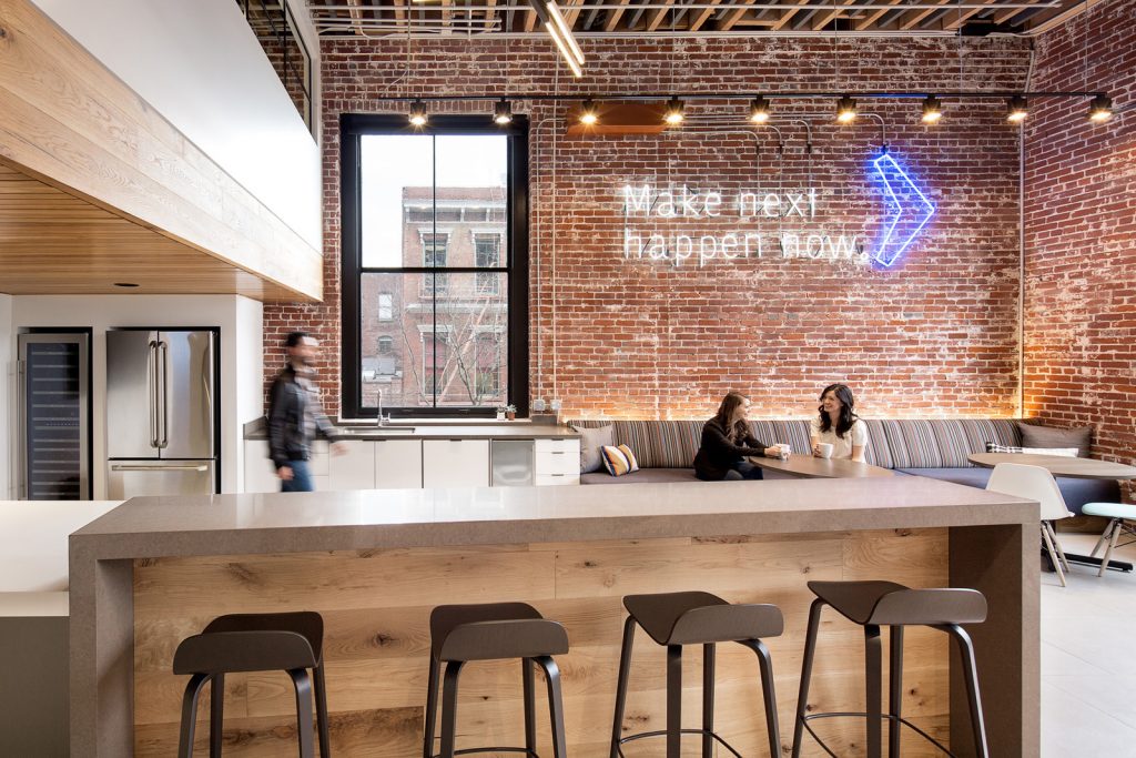 Blue and white neon sign on brick for the office breakroom of Silicon Valley Bank in Portland, Oregon. (Photo: Jeremy Bittermann)