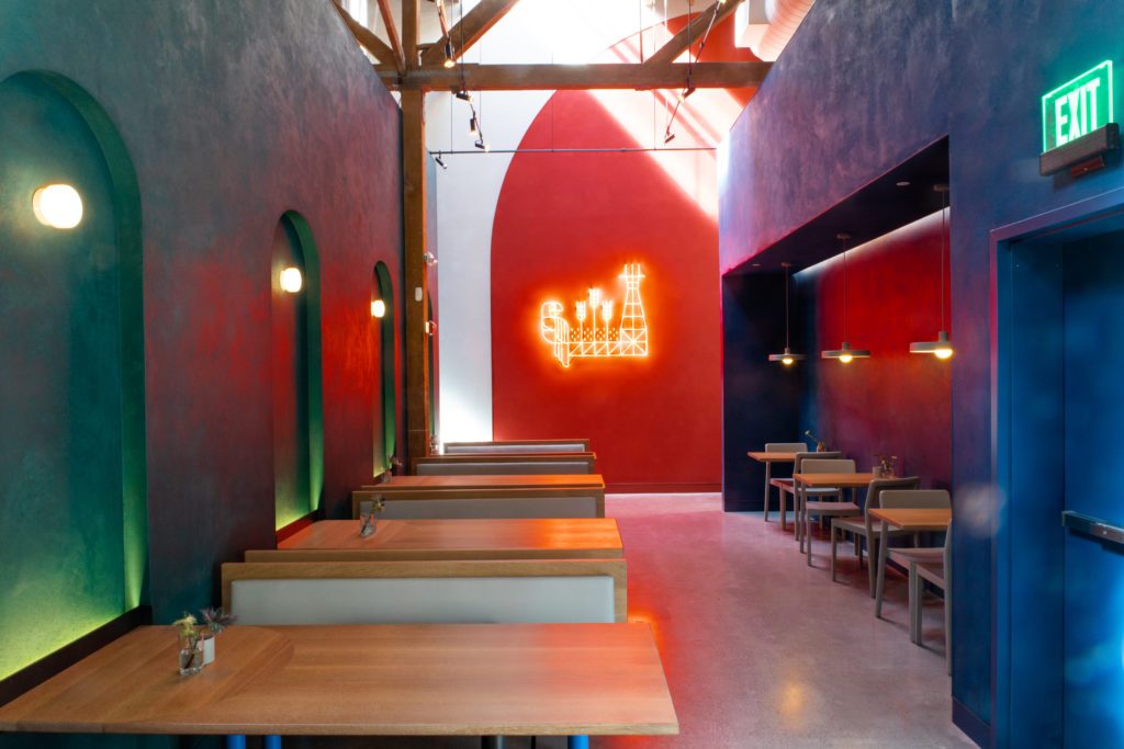 Red neon artwork on red wall for the entrance of Fort Point Brewery in San Francisco, CA. (Photo: Mariko Reed)