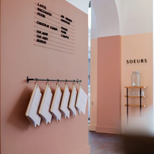 Black menu letters on magnetic rail painted to match wall at Café cantine Soeurs. Designed by ParisBrooklyn