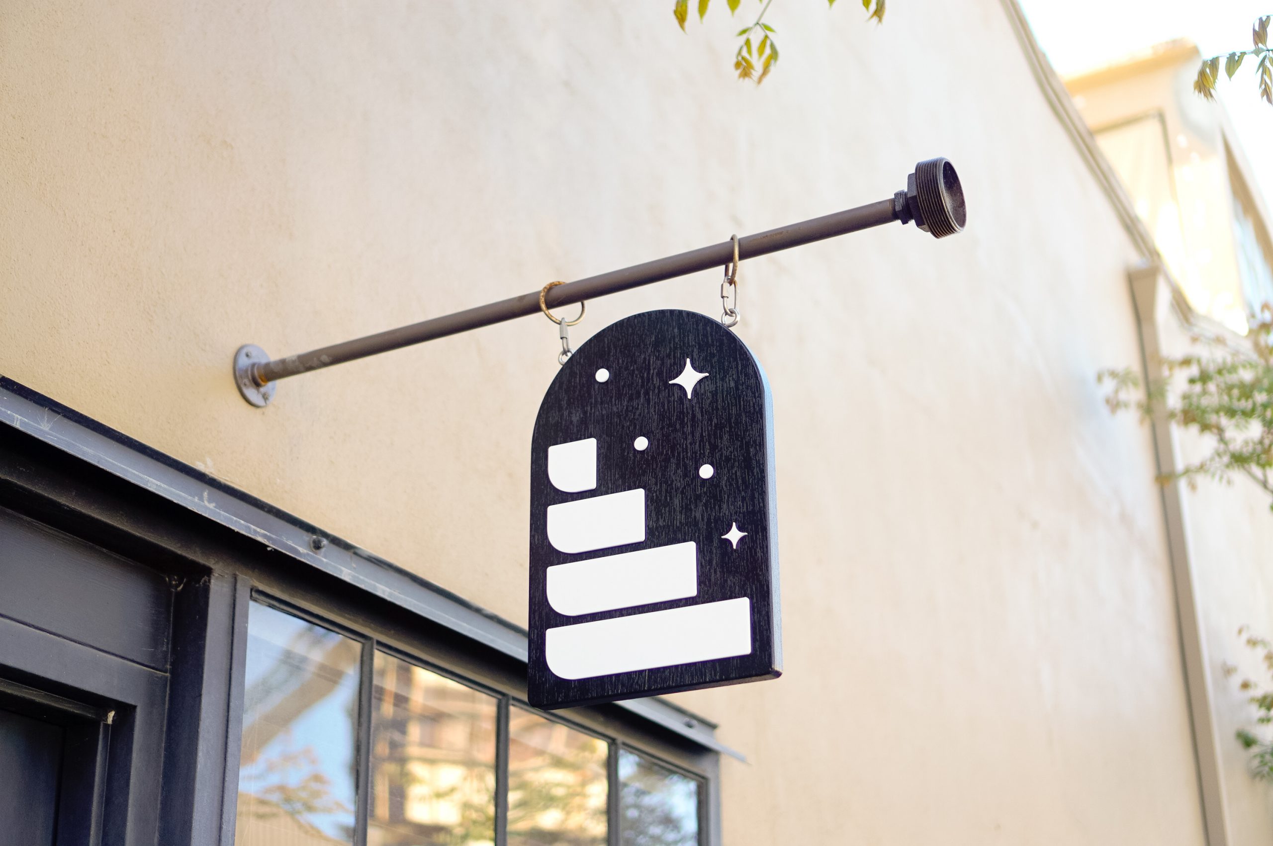 Black and white arched blade sign at the storefront of Hammerling Wines in Berkeley, CA.