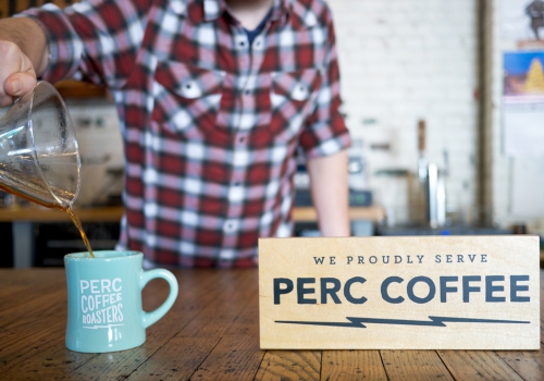 One of several wood retail signs for Perc Coffee, a coffee roaster based in Savannah, GA.