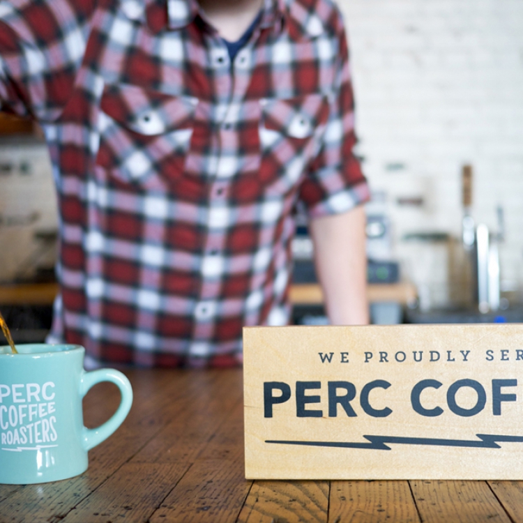 One of several wood retail signs for Perc Coffee, a coffee roaster based in Savannah, GA.