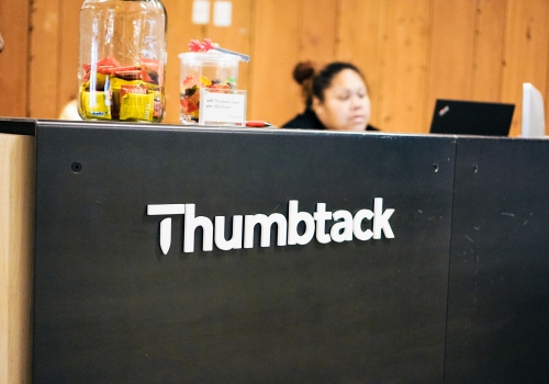 Thumbtack front desk sign