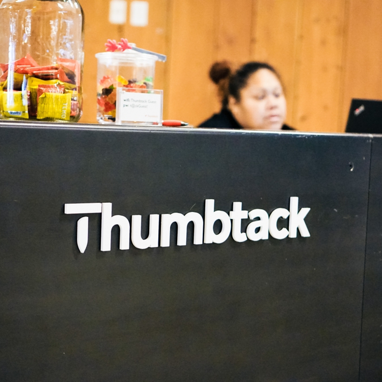 Thumbtack front desk sign
