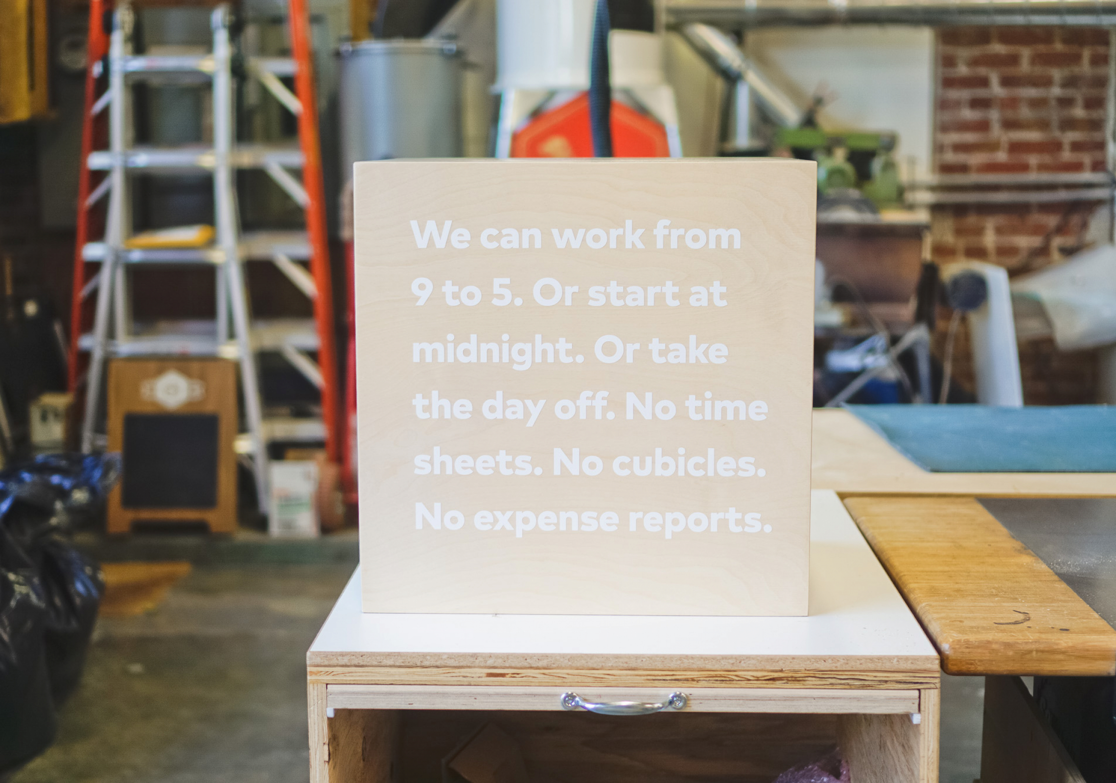 thumbtack manifesto sign - white matte vinyl on wood