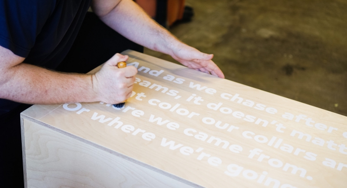 thumbtack manifesto sign - white matte vinyl on wood