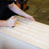 thumbtack manifesto sign - white matte vinyl on wood