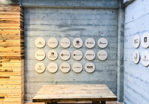 Wall of etched wood plaques with logos for SAP.io in San Francisco Wall of etched wood plaques with logos for SAP.io in San Francisco