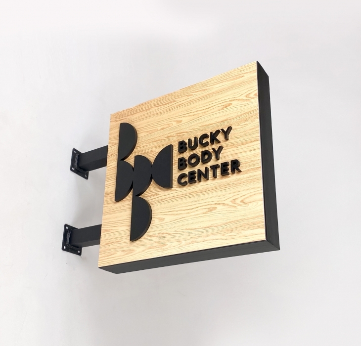 Bucky Body Center Blade Sign