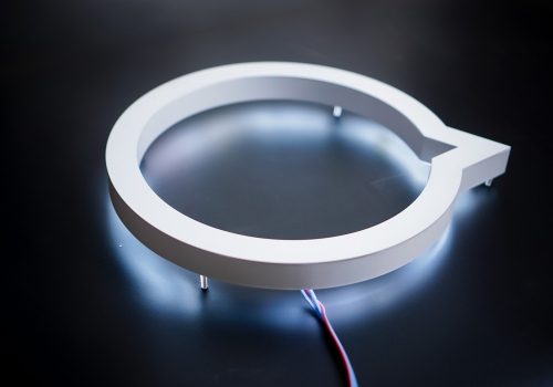 White halo lit illuminated sign for Button, a company that powers mobile partnerships. White halo lit illuminated sign for Button, a company that powers mobile partnerships.