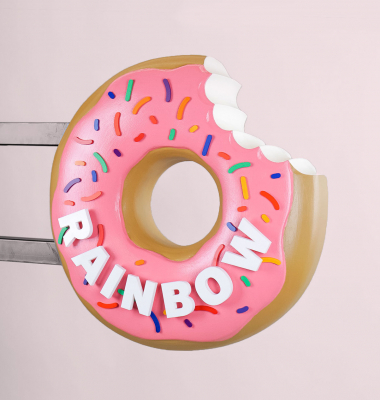 3D, pink-frosted, sculptural, sprinkle donut blade sign for Rainbow Donuts in Berkeley, CA