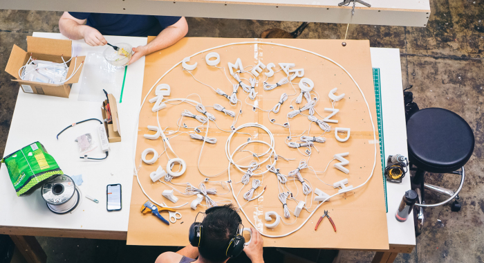 Gratitude post neon style sign with exposed wiring at Dropbox HQ