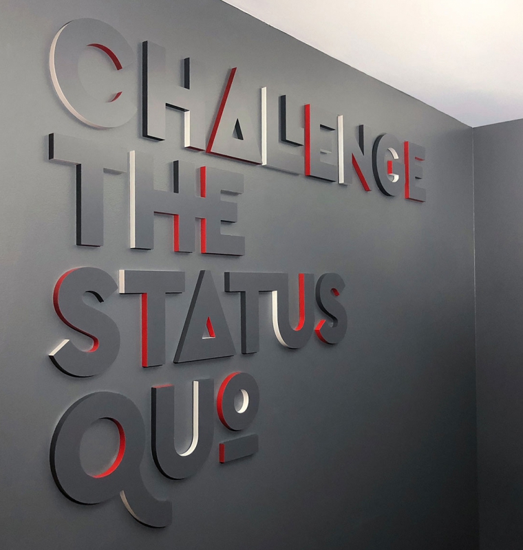 Challenge The Status Quo Lobby Sign at Envoy