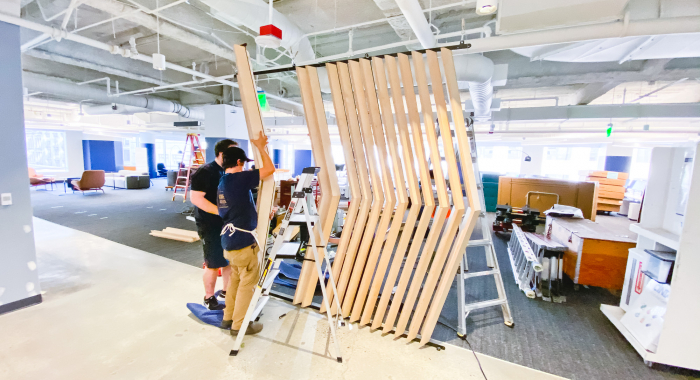 Slat wood divider wall installation for Flexport, a freight forwarding and customs brokerage company based in San Francisco, California.