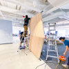 Slat wood divider wall installation for Flexport, a freight forwarding and customs brokerage company based in San Francisco, California.