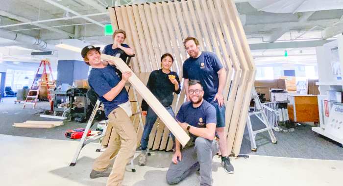 Slat wood divider wall installation for Flexport, a freight forwarding and customs brokerage company based in San Francisco, California.