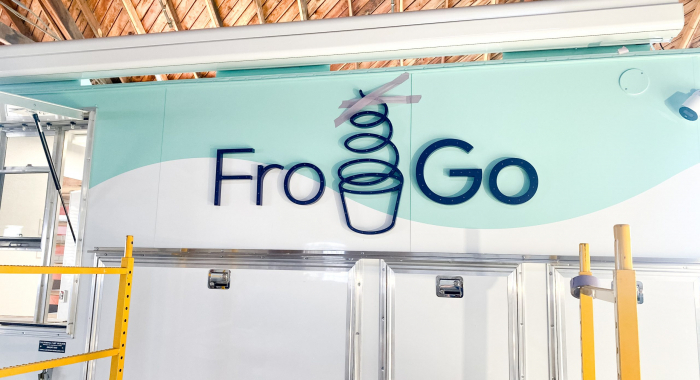 Illuminated, marquee-style sign on food truck for FroGo, a customizable, self-serve, dairy-free, frozen yogurt truck.