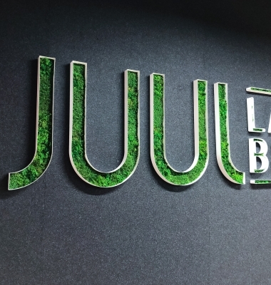 Moss filled lobby sign for the San Francisco office of Juul, an electronic cigarette company.