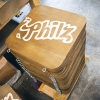 Wood hanging sign for Philz Coffee, an American coffee company and coffeehouse chain based in San Francisco, California, considered a major player in third wave coffee.