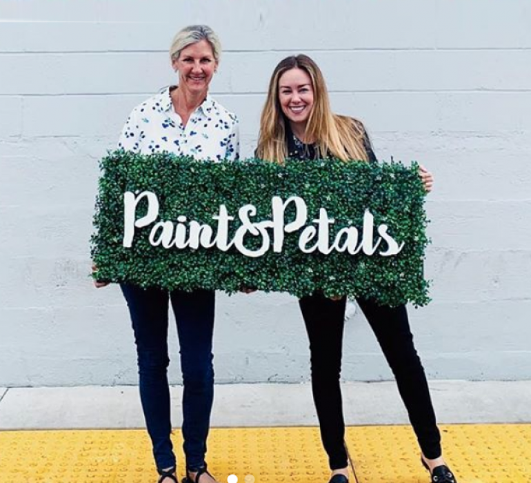 Faux boxwood sign with white script text for Paint & Petals, a California-based housewares collection created from Bridgette Thornton’s hand-painted designs.