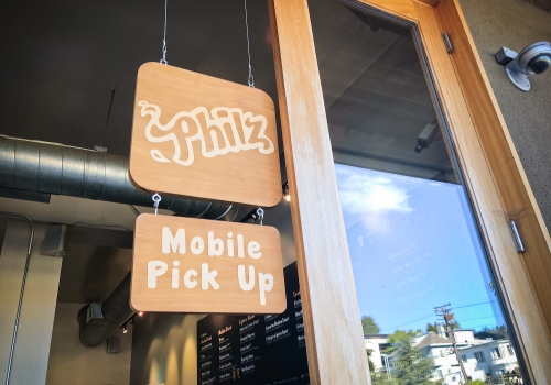 Wood hanging sign for Philz Coffee, an American coffee company and coffeehouse chain based in San Francisco, California, considered a major player in third wave coffee.