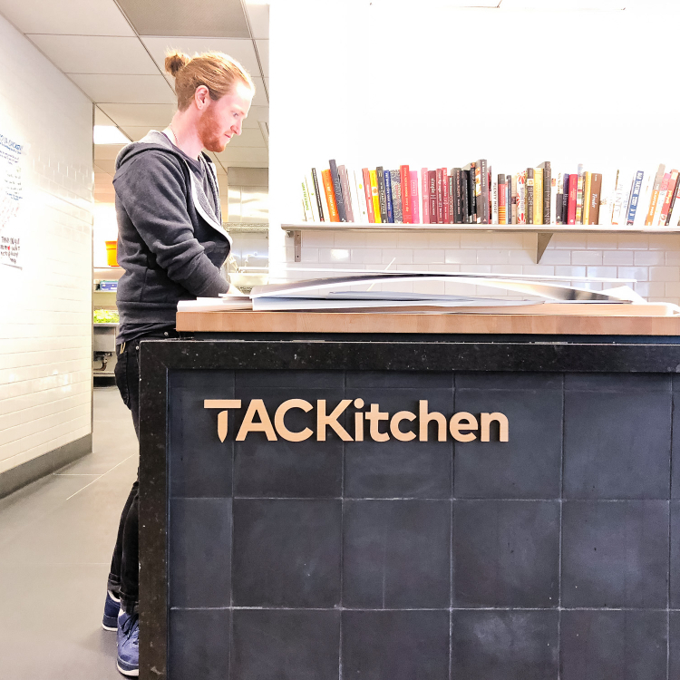 Wood letters on front counter at the cafeteria/kitchen of Thumbtack, an online service that matches customers with local professionals.