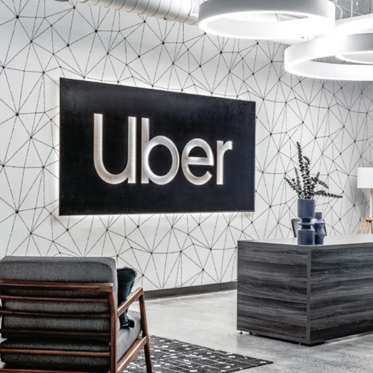 Black and white lobby sign for Uber, an American multinational transportation network company.